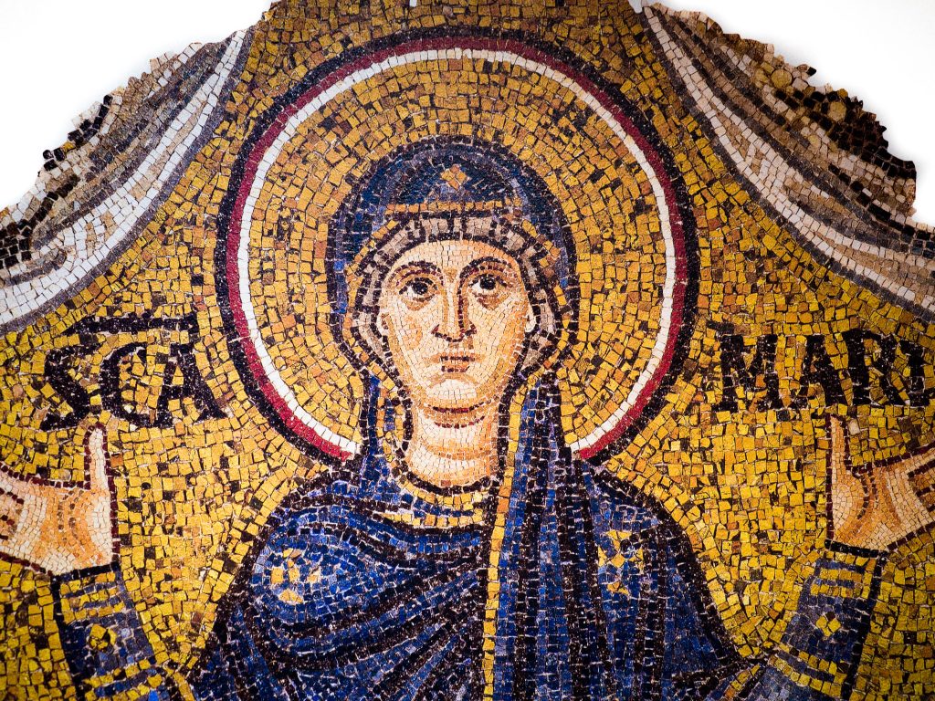 Figure 4: Fragment of a mosaic of Mary from Ravenna, Italy, from the Ursiana Basilica. Housed at the Archiepiscopal Museum. Note the similarity of her expression and attire to Versace’s design. Photograph © Alamy. 