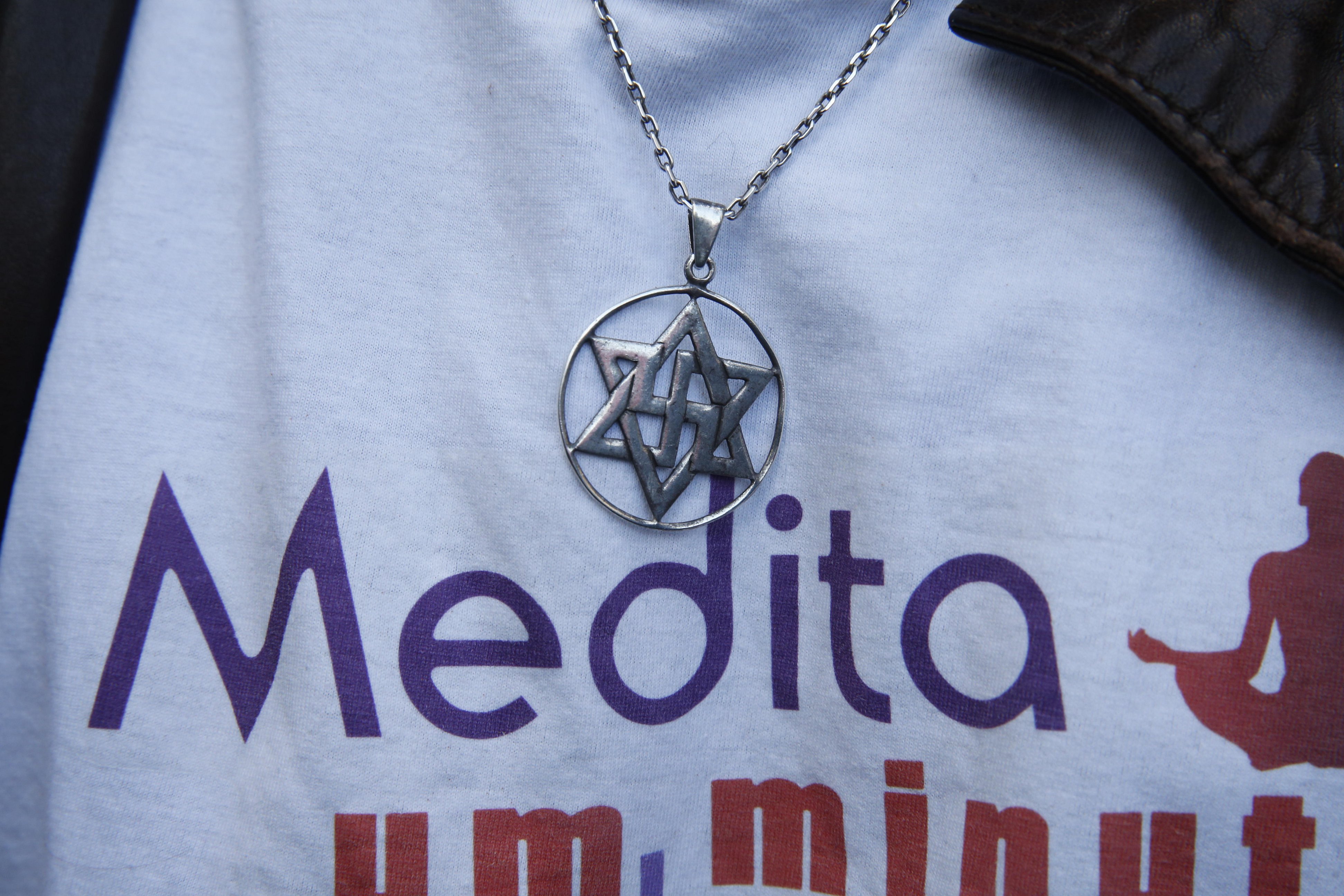 Figure 2: A close-up of the Raelian medallion being worn with a T-shirt. Photograph by Godong/Alamy.