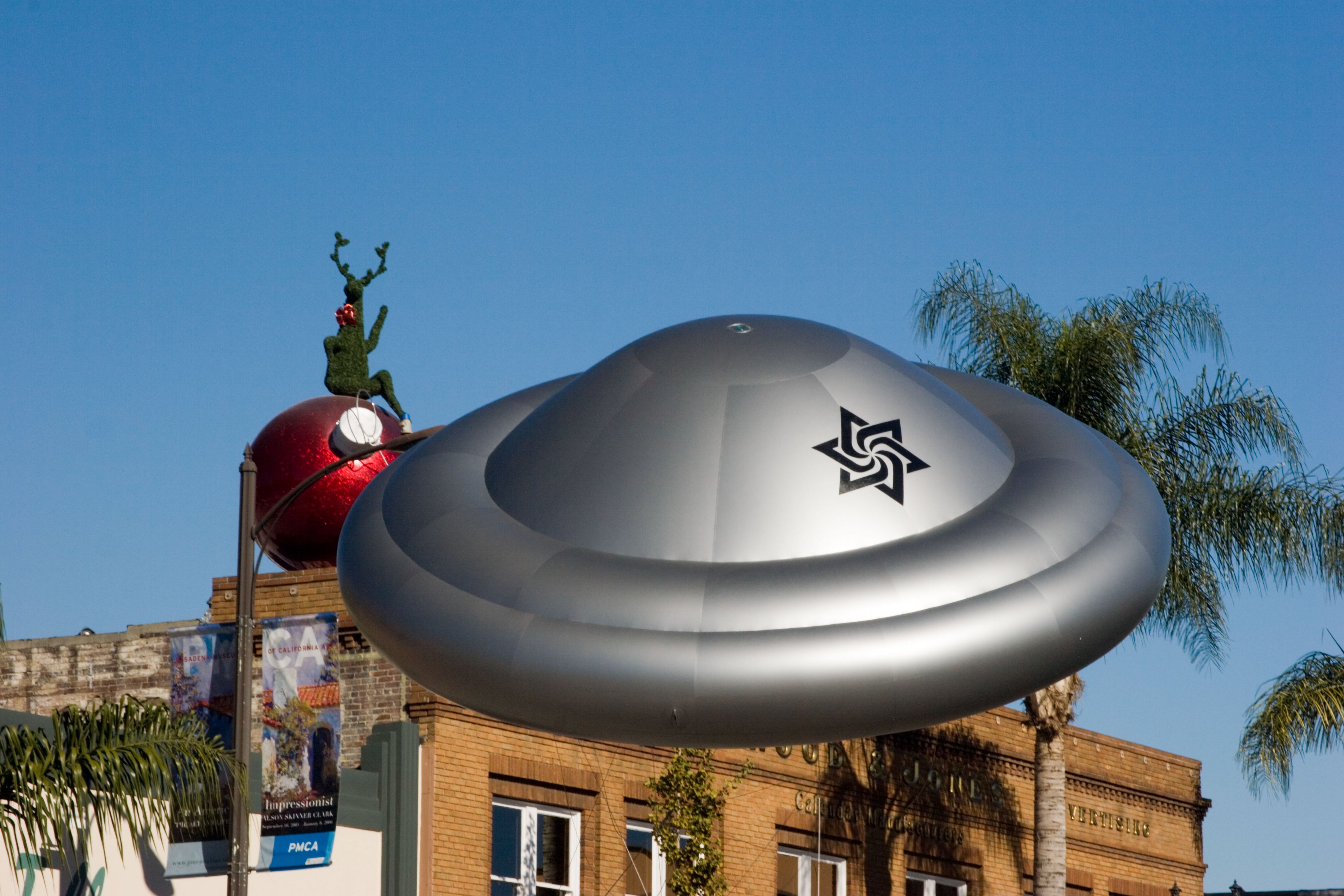 Figure 3: The altered Raëlian symbol can be seen on this inflatable spaceship. This highlights how the symbol is used in advertising, literature, merchandise, and at events.