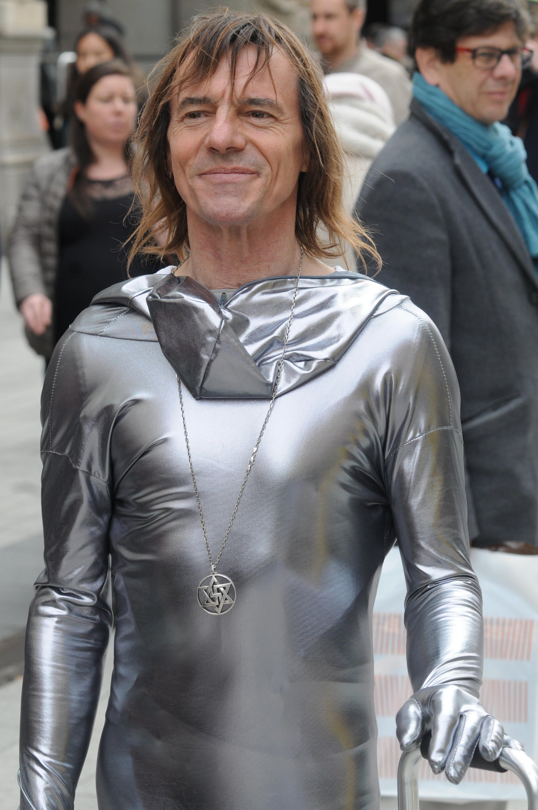 Figure 4: Raëlian wearing medallion and space-inspired outfit at public event. Photograph by Serge Mouraret/Alamy.
