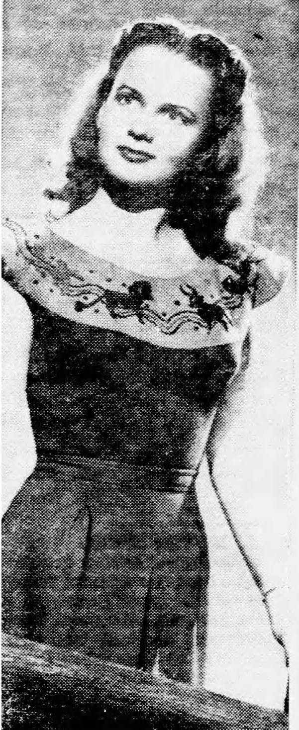 Figure 2: Actress Marilyn Erskine wearing a version of the “horoscope” dress designed by Emily Wilkens in 1945. Published in Newsday (Suffolk Edition) (Melville, NY) 22 August, 1945, 11. Fair Use.