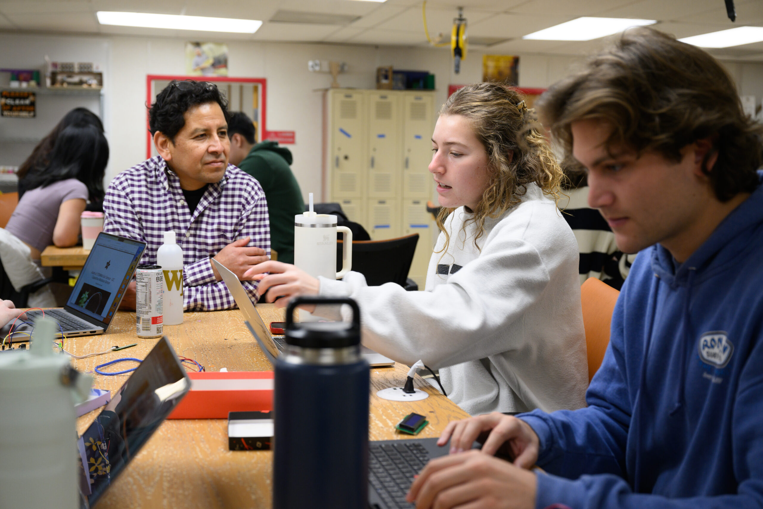 Computer Science Prof. Paúl Pauca teaches a Mobile and Pervasive Computing class at WakerSpace on Thursday, February 6, 2025.    Colin Ward ('25), right, and Ashlyn Morick ('25) work together in class.