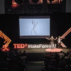 The two Christinas presenting onstage at TEDx
