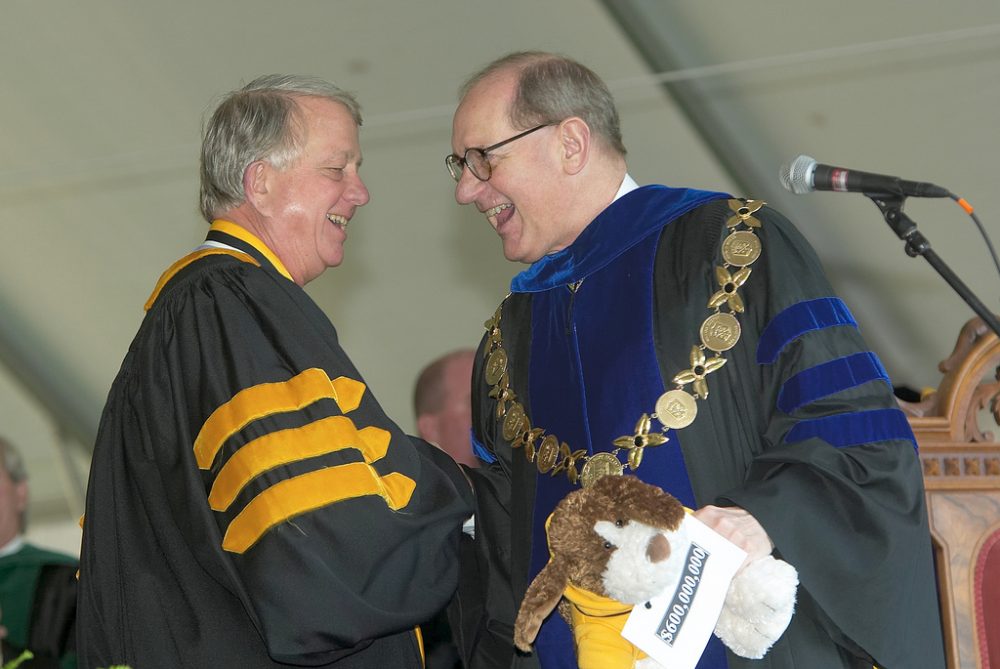 President Thomas K. Hearn Jr., right, and Murray Greason react to the news that the capital campaign has realized its $600 million goal more than a year ahead of schedule.