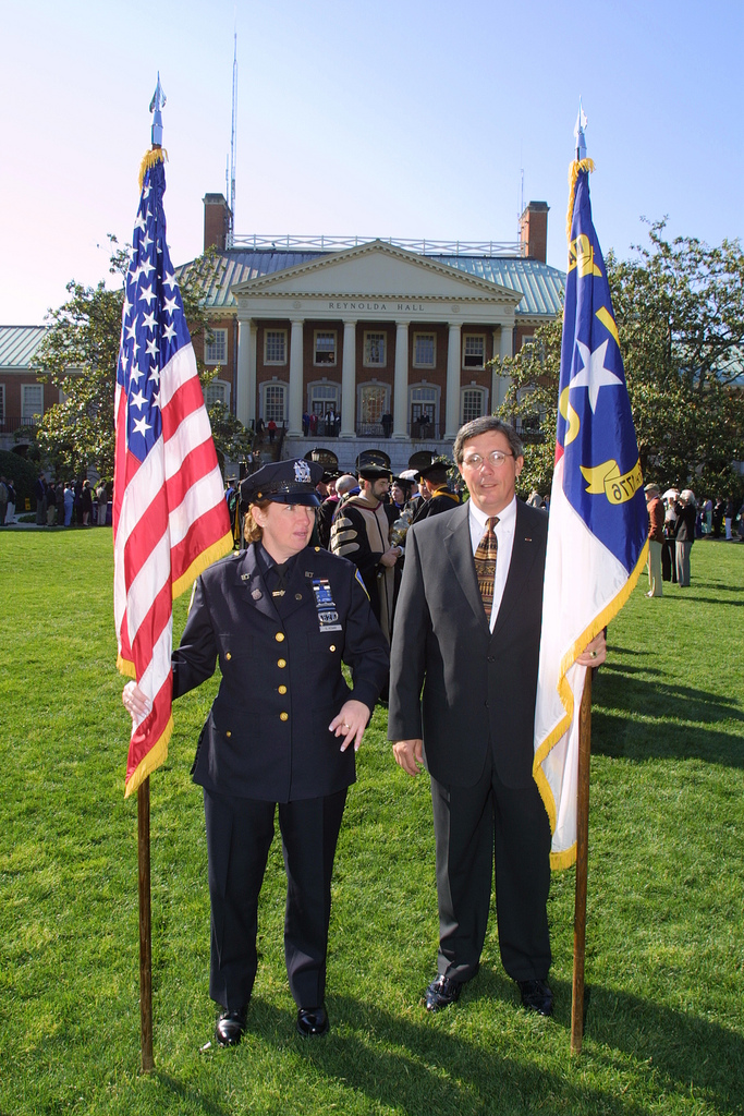 Port Authority police officer S. Keane and WFU University Stores director Buz Moser.