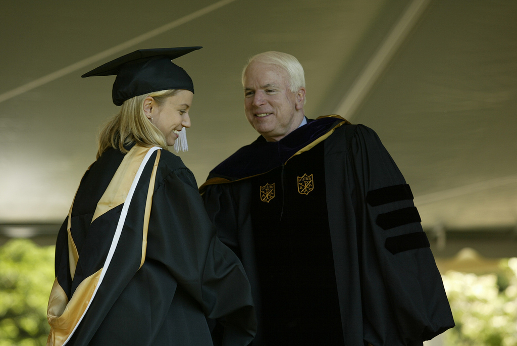 Senator John McCain greets a graduate.