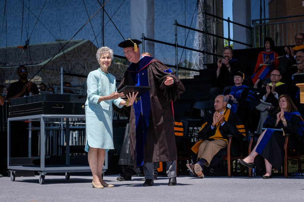 President Nathan O. Hatch presents a posthumous diploma for business school student Neal Chastain to his mother, June Booth.