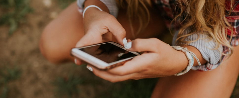 girl looking at her phone
