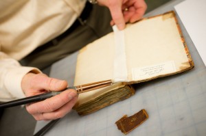 Craig Fansler repairing a book