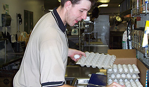 A student works in the kitchen.