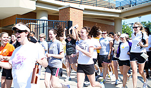 Women run onto the field for the football clinic