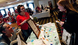 A customer and a vendor at the 2011 Artisan's Fair.