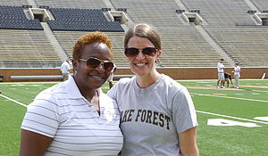 Associate head coach Billy Mitchell keeps season ticket holder Emily Beaver (’03) on her toes.