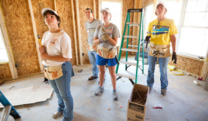 Staff members work on the 2010 house.
