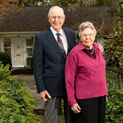 Henry and Elizabeth Stroupe pose in front of their Faculty Drive home in 2006.