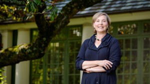 Allison Perkins, the director of the Reynolda House Museum of American Art at Wake Forest University, poses outside the house on Tuesday, June 23, 2015.