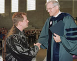 Jeffrey D. Lerner, left, receives award from Dean Paul Escott