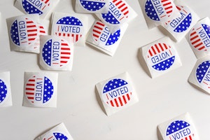 Several round stickers with the U.S. flag and the words "I Voted"