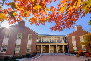 The Porter Byrum Welcome Center and orange maple leaves