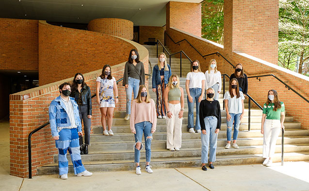 Members of the quadrennial Art Buying Class at Wake Forest wear face masks and pose for a group photo outside Scales Fine Arts Center