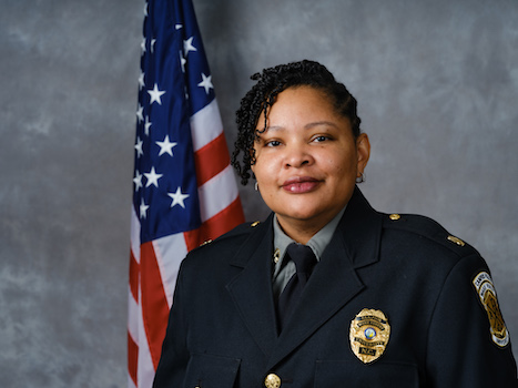 Headshot of Major Derri Stormer, of the Wake Forest University Police Department, in uniform in front of an American flag