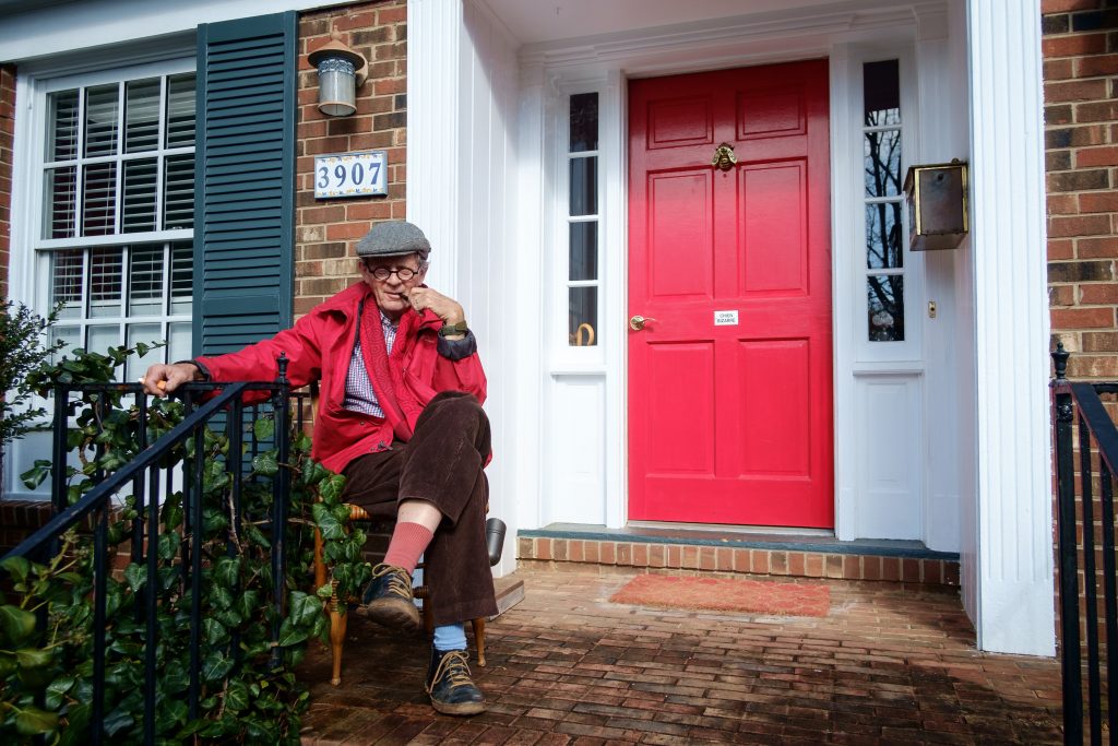 Billy Hamilton enjoying a pipe on his front porch on a warm winter day.