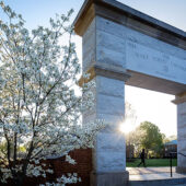 WFU arch at entrance to Hearn Plaza and spring trees