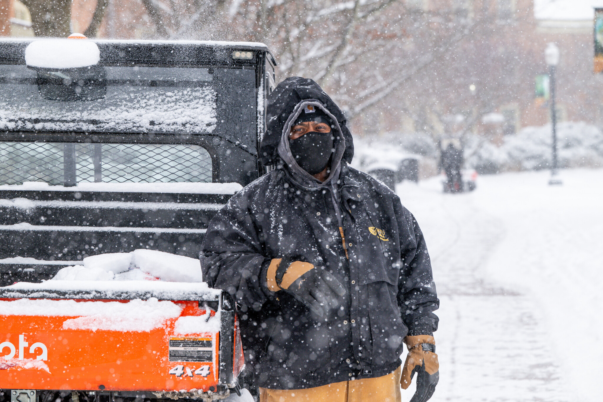 Facilities team member in snow