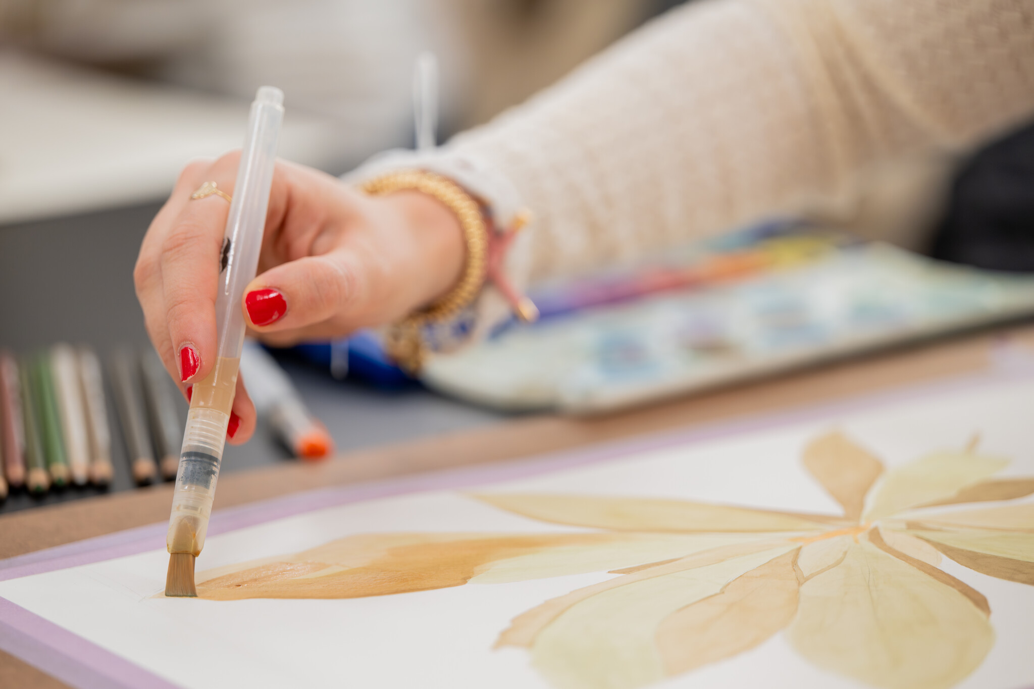 student drawing plant