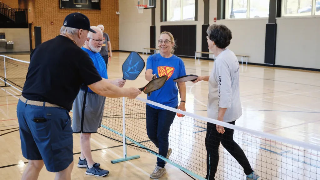 retirees playing pickleball