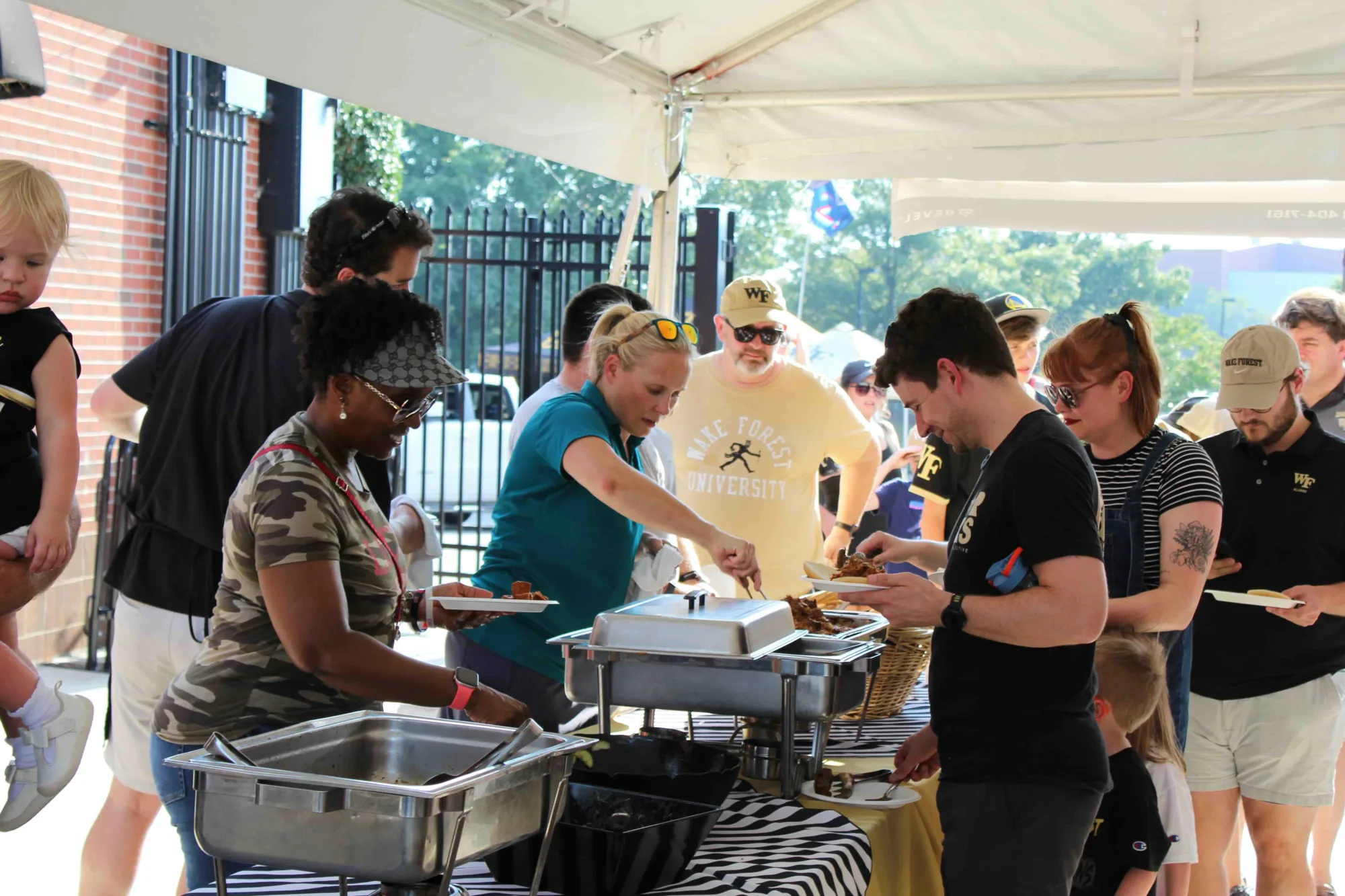 Photos of faculty and staff at the 2026 Tailgate